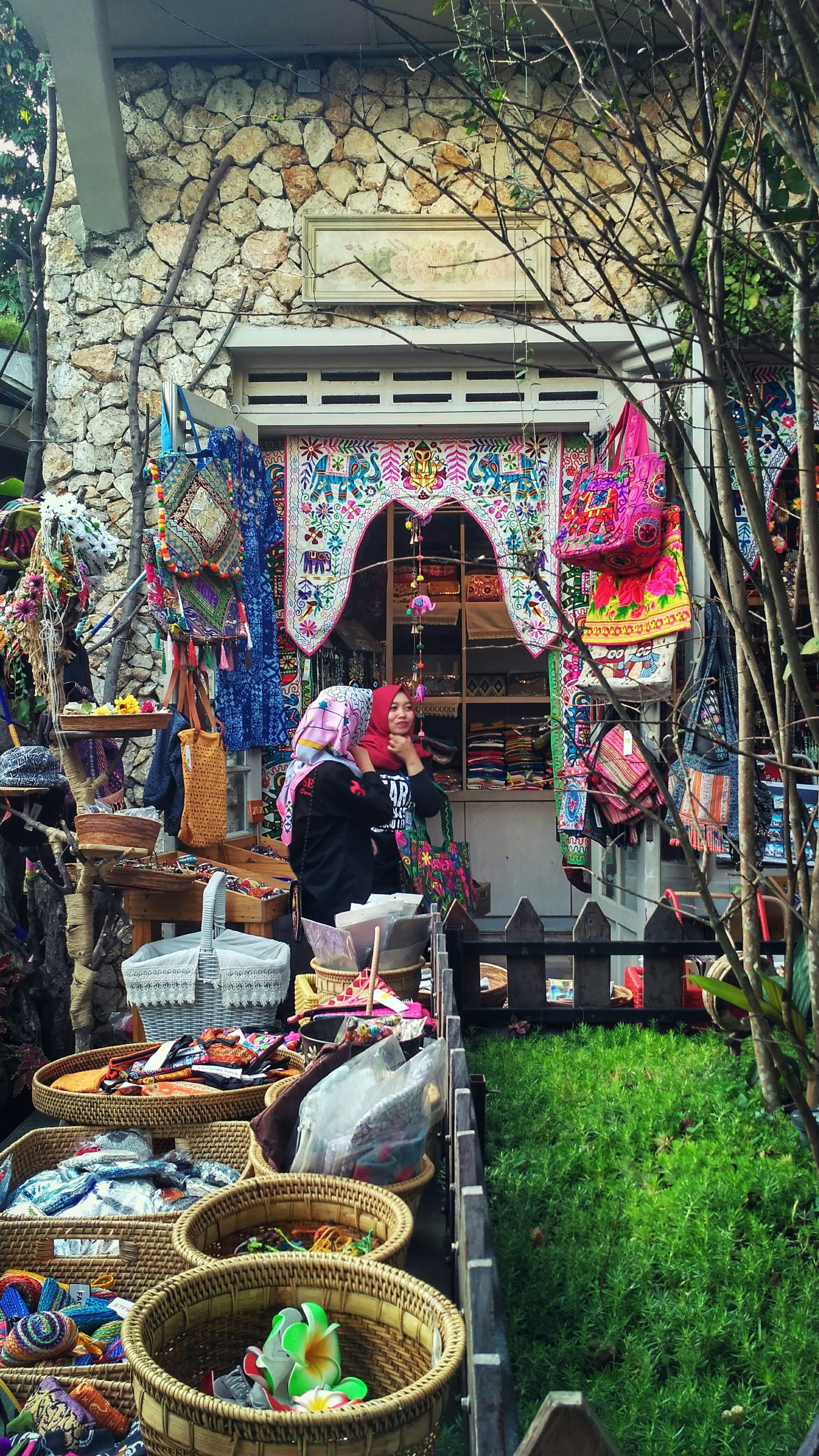Women shopping together with colourful bags in a bright store
